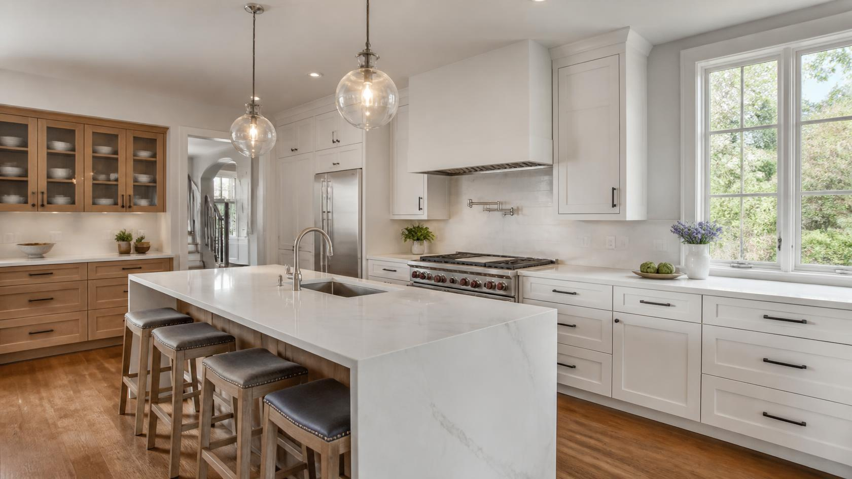 Modern Massachusetts kitchen featuring elegant quartz countertops with subtle veining and a large center island.